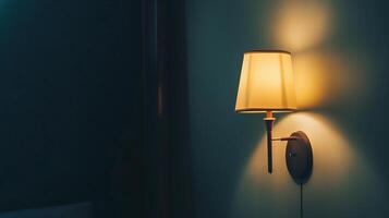 Close up shot of a night lamp next to a bed photo