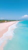 Aerial View of Pristine White Sand Beach with Turquoise Waves and Clear Blue Sky in Tropical Paradise for Travel Concept and Coastal Design photo