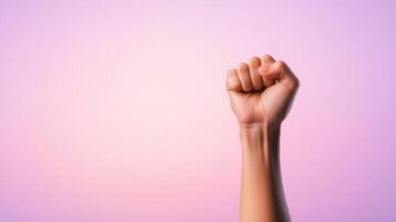 Fist Raised in Advocacy Against Epilepsy on Gradient Pink Background for Awareness Campaign and Support photo