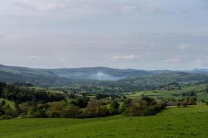 Serene rural landscape with rolling hills photo