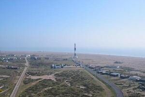 Aerial view of Dungeness Lighthouse in a beautiful sunny day photo