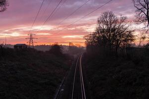Plymouth Railway disappearing into the fog during a colorful sunrise in Plymouth, England photo