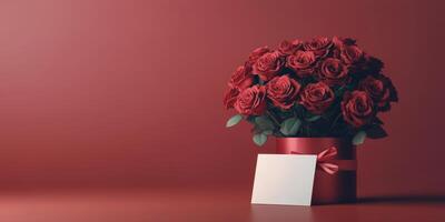 Beautiful arrangement of red roses with blank card on red background for special occasions photo