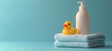 Relaxing bath setup with a rubber duck, lotion bottle, and soft towel on a blue background photo