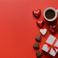 Elegant arrangement of chocolates and coffee on a red background for a special celebration photo