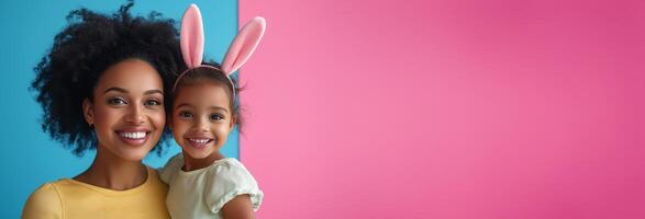 Smiling mother and daughter celebrate together with bunny ears during festive occasion photo