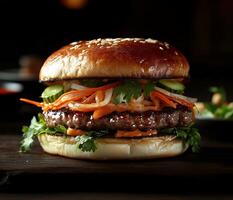 Gourmet burger with fresh vegetables and sesame seed bun served in a cozy restaurant setting photo