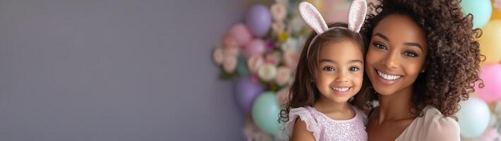 Mother and daughter celebrating together with bunny ears in a colorful festive setting photo