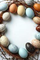 Colorful decorated eggs arranged in a wreath for Easter celebration at springtime photo