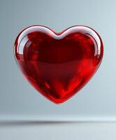 Red heart shape floating in a light background represents love and affection photo