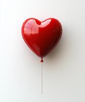 Bright red heart-shaped balloon floating against a clean white background photo