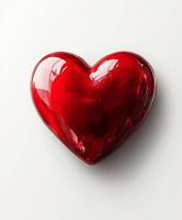 Bright red heart shaped decoration on a light background photo