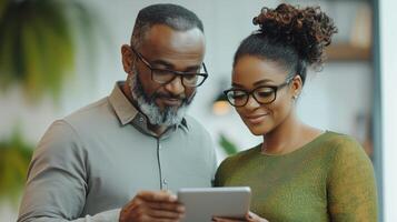 Couple Enjoying Time Together While Exploring Tablet Software at Home photo