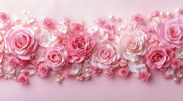 Beautiful arrangement of pink roses and flowers on a soft pink background photo