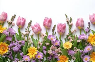 Colorful arrangement of spring flowers on a white background for decoration and celebration photo