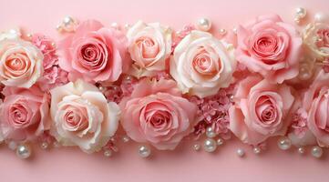 Elegant arrangement of pink and white roses with pearls on soft pink background photo