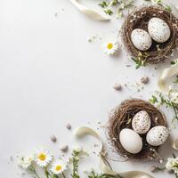 Decorative nests with speckled eggs and spring flowers arranged for an Easter celebration photo