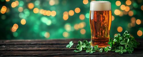 Refreshing beer glass with clovers on wooden table amid festive lights in the background photo