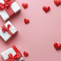 Beautifully wrapped gifts with red ribbons and hearts on a pink background for a special occasion photo