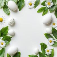 Decorative arrangement of white eggs and daisies on a clean surface for spring celebration photo