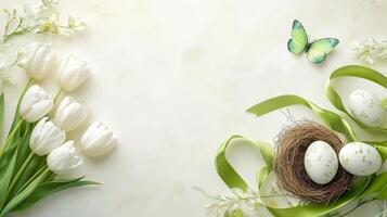 Spring decorations with tulips, butterfly, ribbon, and Easter eggs on a light background photo