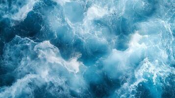 Dynamic waves crashing in the deep blue ocean during the daytime under bright sunlight photo