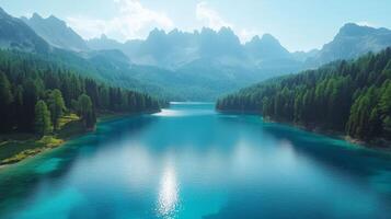 Scenic mountain lake surrounded by lush forests and peaks during a bright sunny day photo