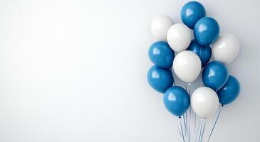 Balloons in blue and white arranged against a light background for celebration decor photo