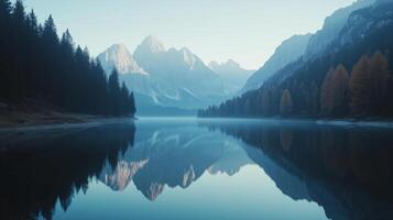 Beautiful mountain reflection in tranquil lake at dawn in the Dolomites photo
