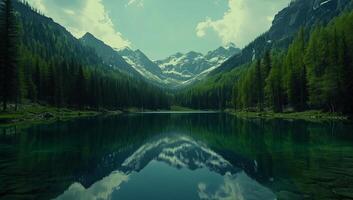 Majestic mountain view reflecting in still lake surrounded by lush forests and towering peaks photo