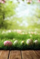 Colorful Easter eggs resting on green grass in a sunny outdoor setting photo
