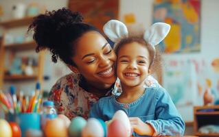 Joyful mother and daughter decorating Easter eggs in a cozy craft room during spring photo