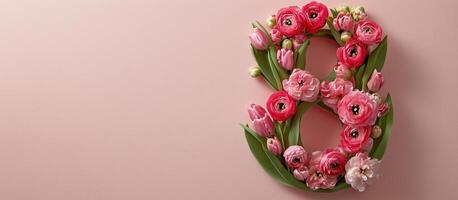 Floral arrangement shaped like the number 8 on a pink background for celebration or decoration photo