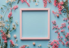 Elegant flower arrangement with a pink frame on a blue background showcasing nature's beauty photo