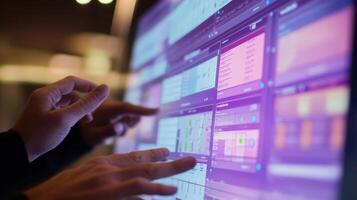 Engineers interacting with digital dashboard for production monitoring and control photo