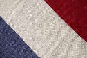 grey white milk and red on knitted fabric abstract background texture. photo
