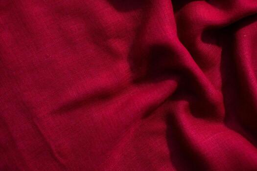 abstract wavy crumpled background Red fabric texture with copy space. photo