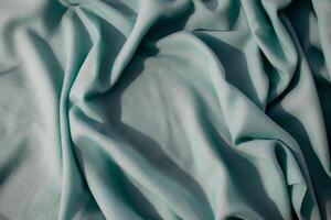 Nude green fabric wavy crumpled abstract background texture with copy space. photo
