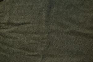 Flat view Green army fabric texture background. photo
