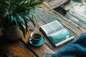 Cup of coffee and book on a wooden table. Selective focus photo