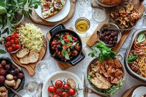 top view of delicious appetizers served on wooden cutting board at table photo