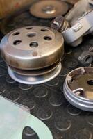 Scooter cvt clutch and variator during maintenance on workbench photo