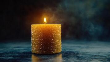 The soft flicker of a candlelight creates a calming atmosphere in the evening photo