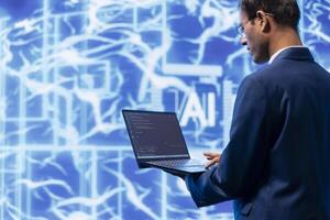 System administrator solving tasks on laptop, running artificial intelligence programming scripts. Technician manipulating lines of code for AI applications development on notebook photo
