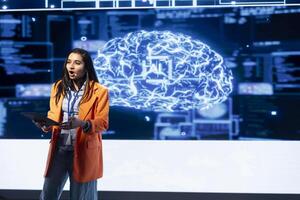 Technician using tablet during presentation, exploring ways emerging AI technologies can enhance businesses. Person at event presents strategies for using artificial intelligence using device photo