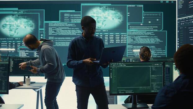 Cyber investigation team working in a governmental hacking room, working on computer security and phishing detection. Emphasizing online security, digital threats and malware prevention. Camera B. photo