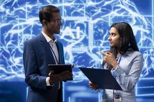 AI researcher and colleague working with artificial intelligence neural networks in modern lab. System administrators collaborating on developing AI system in high tech workspace photo