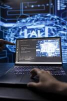 Data scientist in high tech lab analyzing complex AI brain models on laptop. Engineer at work using machine learning on notebook to develop artificial intelligence technology photo