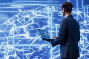 System administrator in workspace analyzing AI brain models. Employee in high tech location using machine learning to better understand and develop artificial intelligence photo