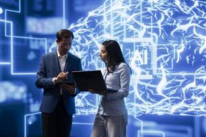 Colleagues using AI neural networks modeled after human brain, brainstorming ways to solve complex problems. IT department employees using deep learning to look at data and complete tasks, camera A photo